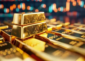 Gold bars and jewelry display board showing updated retail prices in a Dubai gold shop.