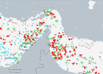 Satellite and maritime AIS traffic map showing shipping lanes in the Strait of Hormuz near Oman.