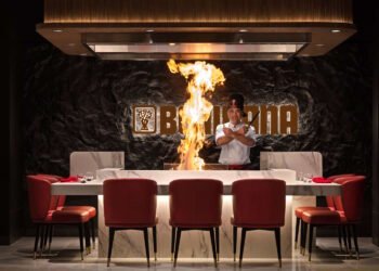 Chef performing live teppanyaki cooking at Benihana Ibn Battuta restaurant Dubai