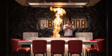 Chef performing live teppanyaki cooking at Benihana Ibn Battuta restaurant Dubai