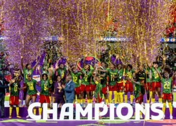 Cameroon women's national football team celebrating with the WAFCON trophy in Rabat.