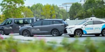 Baidu Apollo Go autonomous Robotaxi driving on a street in Dubai, UAE