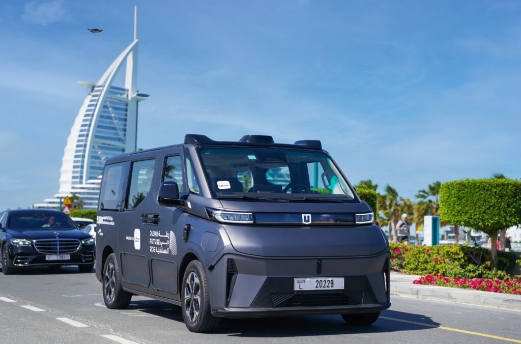 Baidu Apollo Go autonomous Robotaxi driving on a street in Dubai, UAE