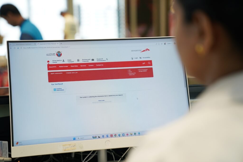 Optometrist conducting a digital eye test for a driving licence applicant in Dubai.