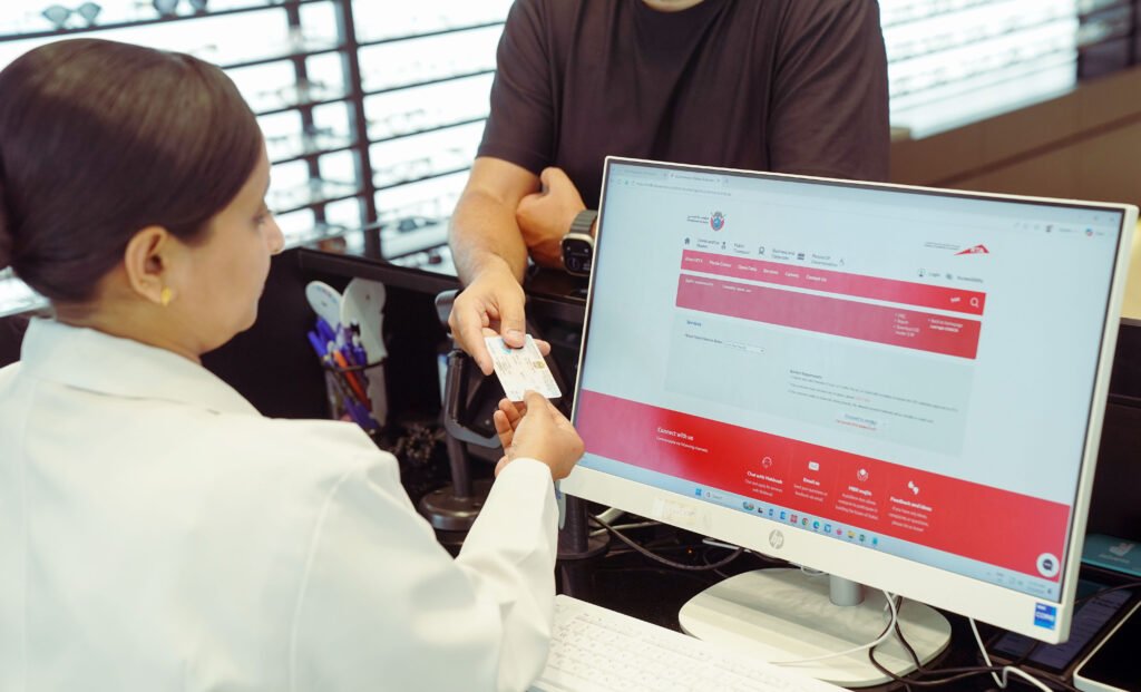 Optometrist conducting a digital eye test for a driving licence applicant in Dubai.