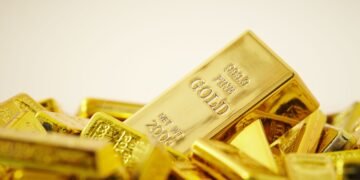 Gold prices fell to a two-week low of $4,417.04 per ounce on Monday following hawkish signals from Fed Chair Kevin Warsh regarding U.S. interest rates.