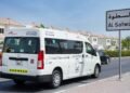 RTA Dubai Bus-On-Demand minibus operating on a city street