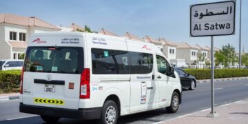 RTA Dubai Bus-On-Demand minibus operating on a city street