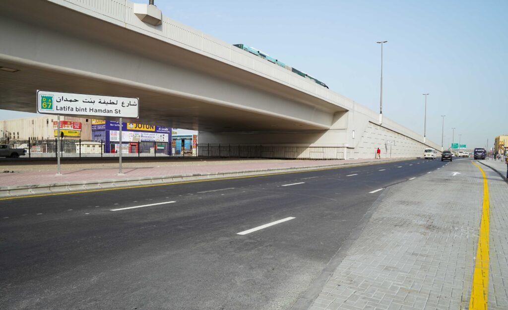 Overhead view of new service lanes and traffic flow on Latifa bint Hamdan Street in Dubai.