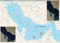 Commercial oil tanker navigating open waters near the Strait of Hormuz under high maritime security patrol.