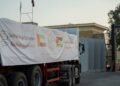 UAE humanitarian aid trucks prepared for Gaza at Al Arish logistics center.