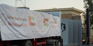 UAE humanitarian aid trucks prepared for Gaza at Al Arish logistics center.