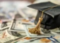 Higher education diploma and university campus background illustrating international student scholarships