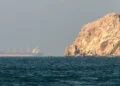 Container ships navigating maritime trade routes in the Gulf region.