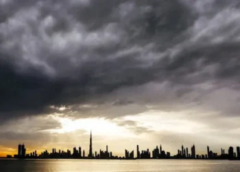 Dark rain clouds over the UAE highway during rain warning