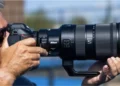 The world’s first*1 interchangeable zoom lens to combine a constant f/2.8 maximum aperture with a built-in 1.4× teleconverter, delivering exceptional optical performance and flexibility for fast-paced shooting environments MIDDLE EAST AND AFRICA, 31 October 2026 - Nikon Middle East FZE is pleased to announce the release of the NIKKOR Z 120-300mm f/2.8 TC VR S, a professional telephoto zoom lens compatible with full-frame/FX-format mirrorless cameras. As part of Nikon’s S-Line2 range, the NIKKOR Z 120-300mm f/2.8 TC VR S is the world’s first1 interchangeable zoom lens to combine a constant maximum aperture of f/2.8*3 with a built-in 1.4× teleconverter. The lens covers a focal length range of 120–300mm and can extend its reach to 420mm with a single action, giving sports photographers the flexibility to respond quickly to changing shooting conditions without switching lenses. Designed for the demands of professional sports photography, the lens combines exceptional optical performance with the versatility to capture a wide range of fast-moving subjects and shooting environments, including: Low-light indoor figure skating competitions Outdoor sports such as tennis and football matches Wildlife and nature photography Events requiring long-range coverage Its maximum aperture and advanced optical design deliver outstanding resolution and smooth, natural bokeh, enabling photographers to capture athletes’ facial expressions and movements in fine detail, creating immersive images with remarkable clarity. The lens also delivers rendering performance comparable to that of a prime lens across the frame, while offering the flexibility of a zoom. Despite incorporating a built-in teleconverter, it weighs approximately 2,735 g, about 515 g lighter than its predecessor, the AF-S NIKKOR 120-300mm f/2.8E FL ED SR VR, released in 2020. This lighter design, together with the convenience of extending focal length without switching equipment, supports greater mobility and responsiveness when photographing fast-moving sports action. Primary features Feature 1: Precise autofocus for fast-moving subjects The NIKKOR Z 120-300mm f/2.8 TC VR S incorporates Nikon's Silky Swift VCM (SSVCM)*⁴ autofocus drive system. Precise autofocus for fast-moving sports action It is designed to provide fast, precise and smooth autofocus performance, supporting photographers when tracking rapidly moving subjects such as: Athletes Vehicles Animals Performers Birds in flight This makes the lens particularly suitable for sports and action photography, where subjects can move quickly through the frame and decisive moments may last only a fraction of a second. Feature 2: Exceptional optical performance across diverse lighting conditions The NIKKOR Z 120-300mm f/2.8 TC VR S features Nikon's Meso Amorphous Coat, which delivers the highest anti-reflection performance in Nikon's history*⁵, alongside ARNEO Coat to effectively suppress ghosting and flare. Together, these technologies are designed to support clear, high-quality image rendering, even in challenging lighting conditions, such as: Stadium and arena lighting Bright sunlight Strong backlighting Floodlights and stage lighting Feature 3: Stable handheld shooting with advanced vibration reduction The lens delivers up to 6.5-stop*6 vibration reduction (VR) performance at the centre and edges of the frame when used with a camera that supports Synchro VR. This can help photographers: Shoot handheld for longer periods Reduce the effect of camera shake Work more flexibly when a tripod or monopod is not practical Feature 4: Professional handling and durability Designed for demanding shooting environments, the NIKKOR Z 120-300mm f/2.8 TC VR S features an internal focusing (IF) system and an internal zoom mechanism that maintain the overall length of the lens constant during focusing or zooming. For greater handling flexibility, the lens supports Arca-Swiss screw-type quick-release tripod clamps*7 and features a tripod collar with a rubber cushion and integrated finger grip for improved portability. It also accommodates both front screw-on filters and rear slip-in filter holders, while the HB-120 Bayonet Hood, is designed for convenient attachment, removal, and storage. A durable magnesium-alloy construction and extensive sealing provide superior dust- and dripresistant performance*8, supporting reliable operation across a range of outdoor shooting environments. ABOUT NIKON MIDDLE EAST Nikon Corporation is a global imaging and technology company with expertise in optics and precision technologies. Nikon Middle East is part of Nikon Asia, the regional headquarters responsible for the sales, marketing and distribution of Nikon’s imaging portfolio in more than 50 countries across the region. The portfolio spans Nikon Z series mirrorless cameras, NIKKOR lenses, video and cinema solutions, imaging software and cloud services, and accessories. The Nikon Z system brings together Z series cameras and an expanding range of NIKKOR Z lenses. Built on Nikon’s optical heritage, the NIKKOR Z range includes the premium S-Line, developed to deliver advanced optical performance and image quality. Nikon’s video and cinema capabilities are strengthened by RED Digital Cinema, Inc., a subsidiary of Nikon Corporation, while Nikon Imaging Cloud provides connected services for compatible Nikon Z cameras, including Imaging Recipes. Nikon’s portfolio also includes digital SLR cameras, COOLPIX compact cameras and sports optics. Nikon Middle East FZE Ltd For more information, visit: Nikon Middle East: nikon-mea.com Z series mirrorless cameras: nikon-mea.com/mirrorless-cameras NIKKOR Z lenses: nikon-mea.com/mirrorless-lenses Z Cinema: nikon-mea.com/z-cinema Connect with Nikon: Instagram: instagram.com/NikonMEA Facebook: facebook.com/NikonMEA